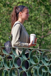 Pretty girl on a metallic bridge